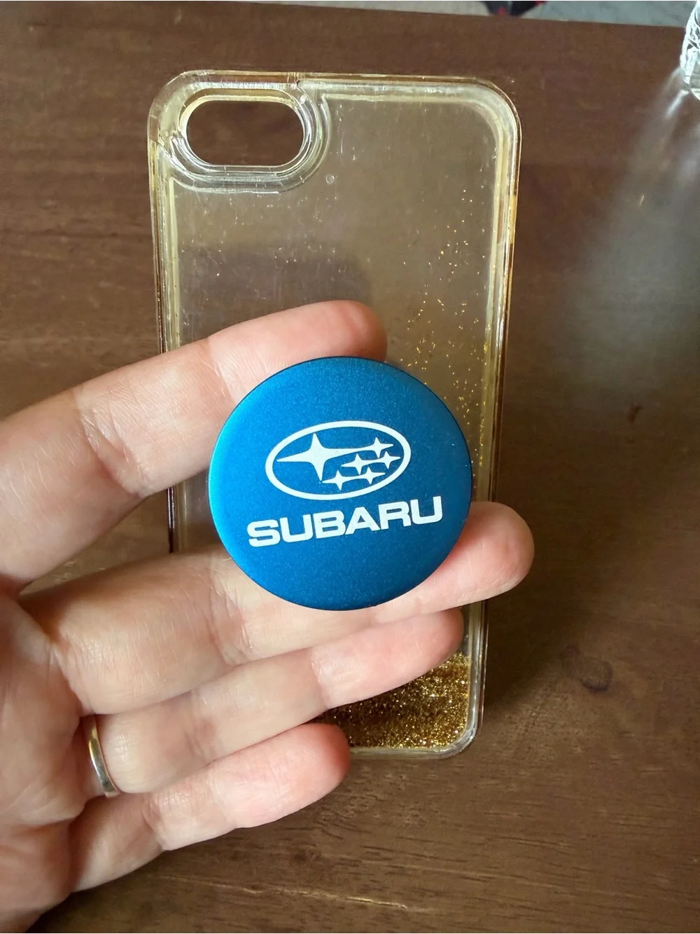 Blue PopSocket Phone Grip with Clear Gold Liquid Glitter Case